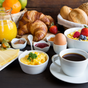 A breakfast buffet with assorted breakfast foods
