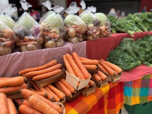 Carrots, onions, potatoes and cabbage available at the farmers market