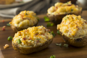 Twice baked potatoes loaded with vegges and cheese