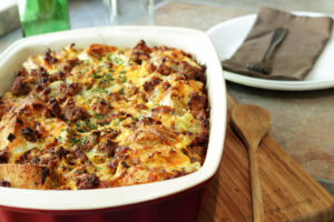 Baked breakfast casserole with eggs and croissants