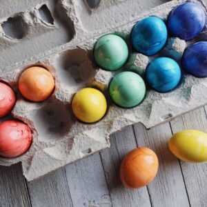 dyed Easter eggs in an egg carton