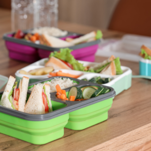 packed school lunchbox with sandwich and veggies