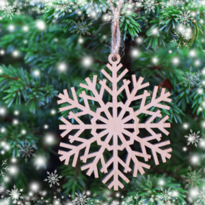 A wooden snowflake on a tree