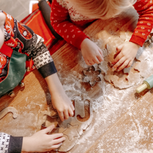 two children making cookies