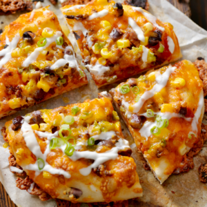 Mexican lasagne cut into quarters ready to serve