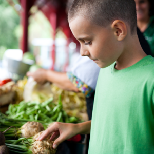 a child shopping at a farmers market
