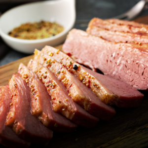 sliced corned beef and cabbage on a platter