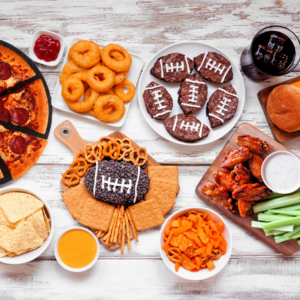 A table filled with food for a super bowl party