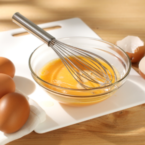 whisking eggs in a bowl