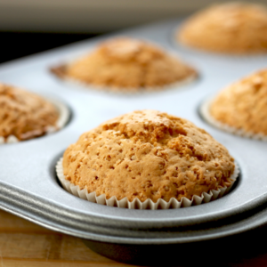 Muffin pan with fresh baked carrot muffins