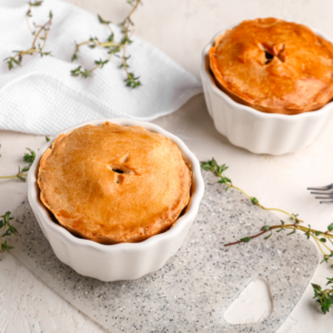 small ham and leek pies for dinner in baking dishes
