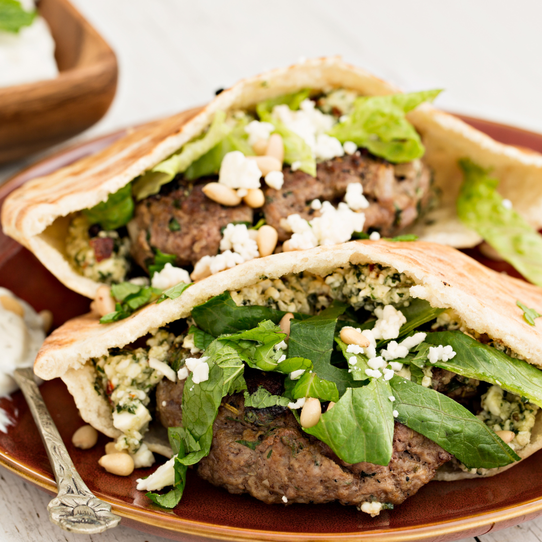 Greek Lamburgers in pita pockets with feta cheese and lettuce